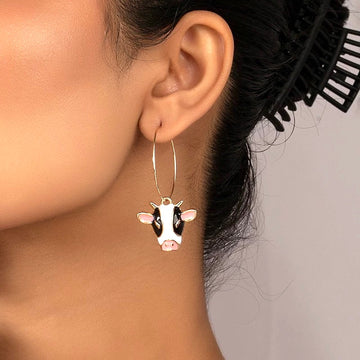 Cow pendant on hoops in gold tone