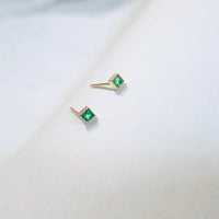 Green gem studs in gold