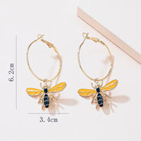 Bee charms on hoop in gold tone