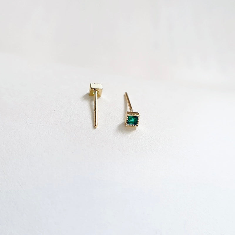 Green gem studs in gold