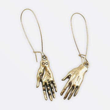 Palm-reading hand earrings